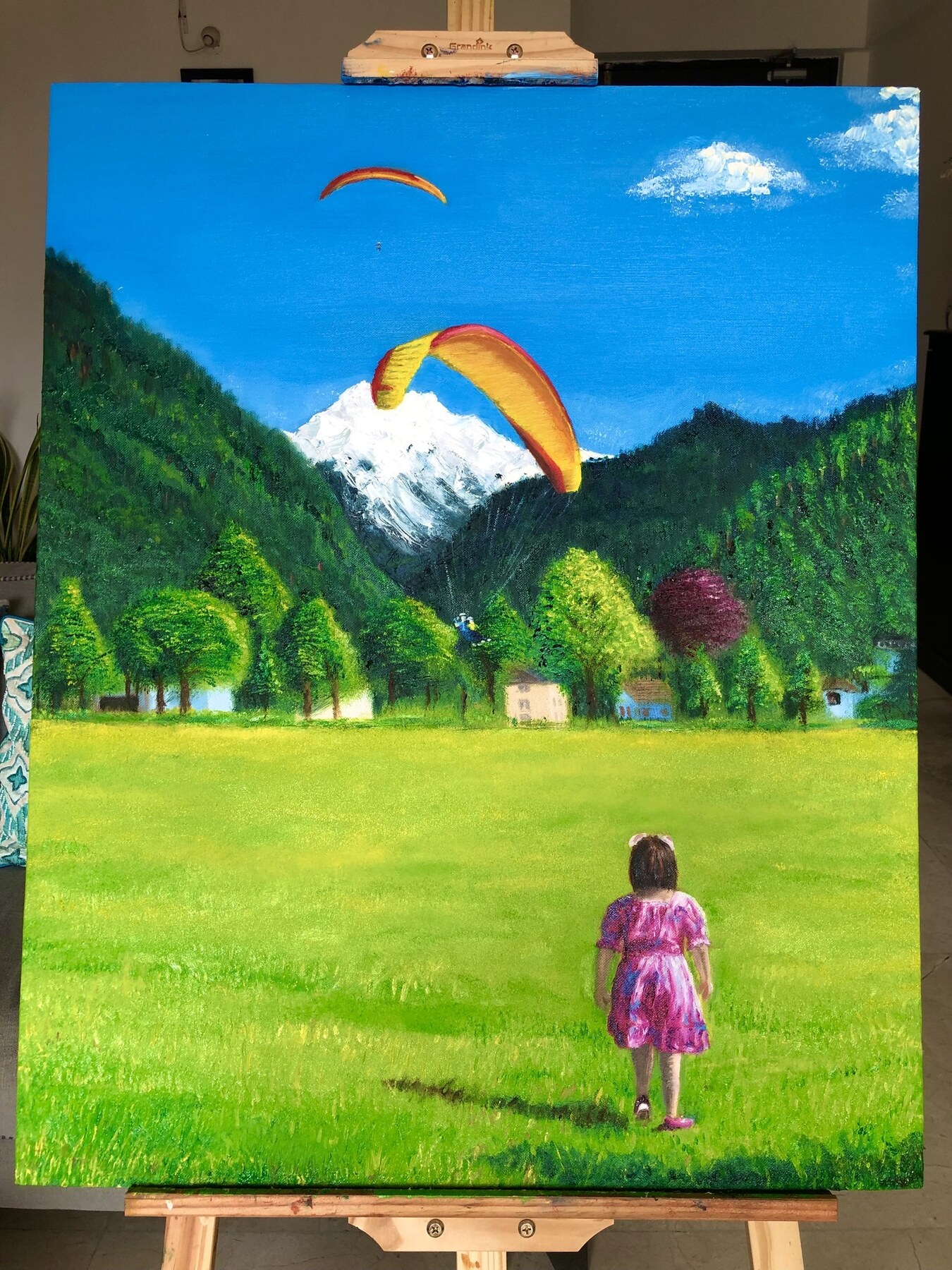 Oil painting of Aahana watching paragliders